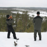 Kauko and his son looking for reindeer